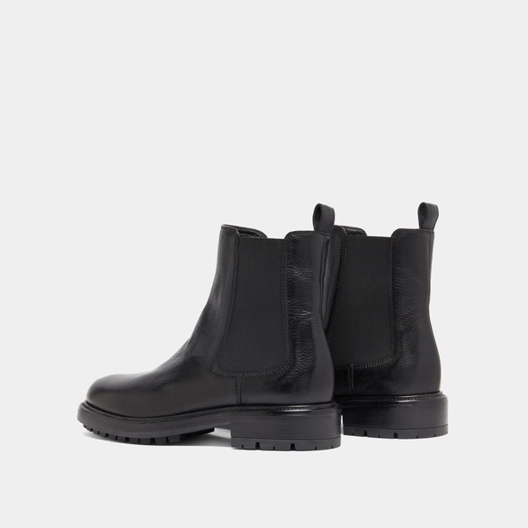 Lowboots with elastic straps and notched soles in black grained leather | CELINA
