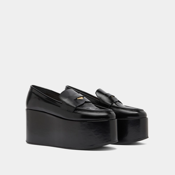 Mocassins à plateformes in black glazed leather | DOPO
