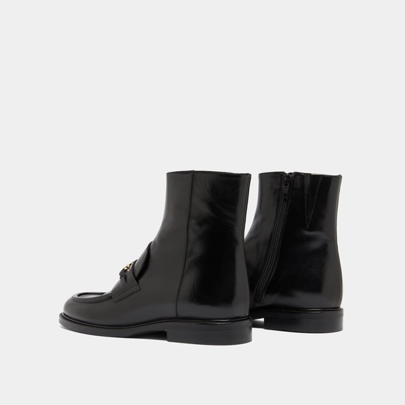 Boots à mors dorés in black leather | DIVOK