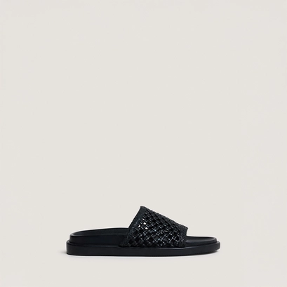 Mules ajour&eacute;es in black leather | wozart