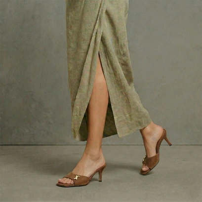 Heeled mules with monogram detail in hazelnut suede | vertige