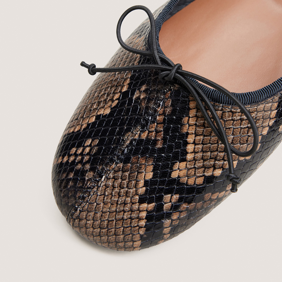 Ballet flats with small laces in taupe python-effect leather | DALLETTE