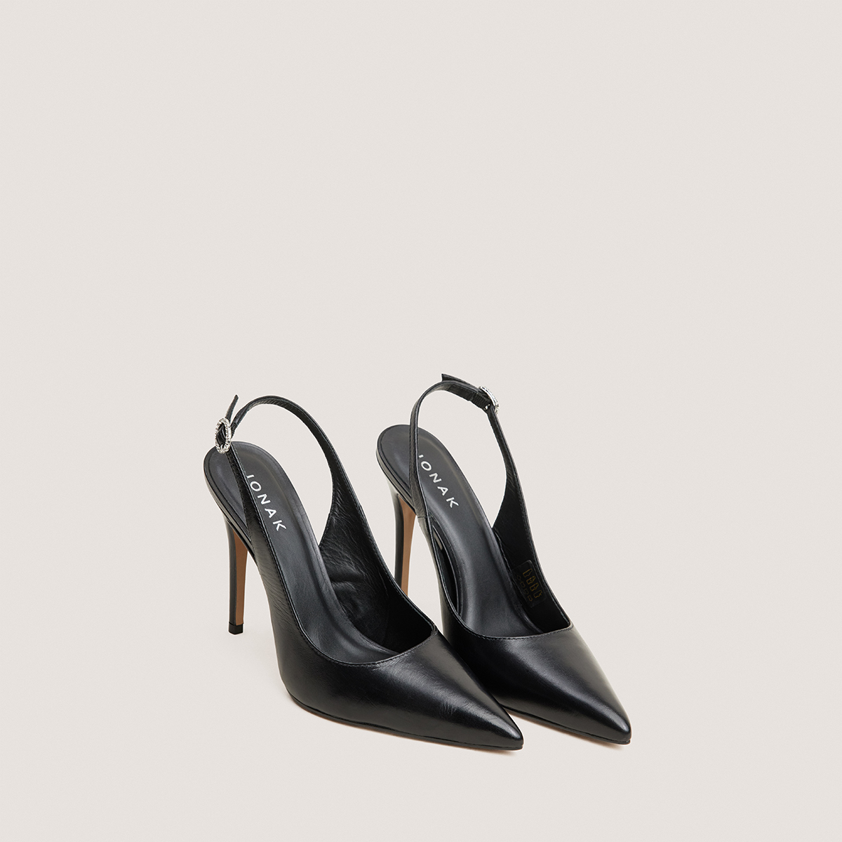 Slingbacks with pointed toes in black leather | FLAMME