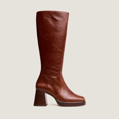 Bottes &agrave; plateformes in distressed brown leather | betina