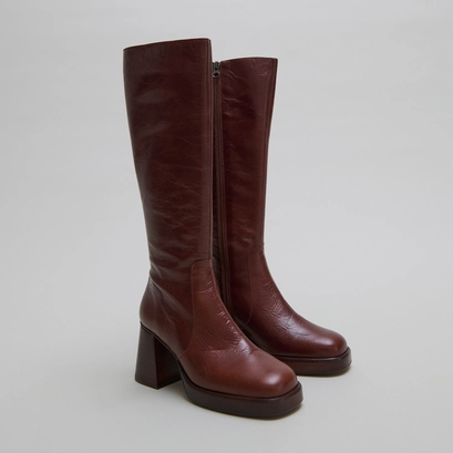 Bottes &agrave; plateformes in distressed brown leather | betina
