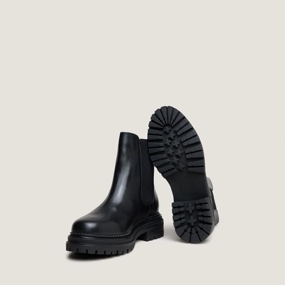 Low boots with notched soles and elastic in black leather | adalard