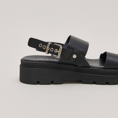 Sandals with thick straps and notched soles in black leather | PEINTURE