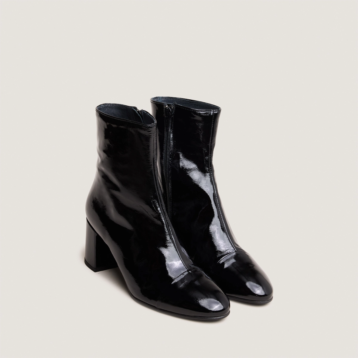 Heeled boots in black pleated patent | DONIAMA