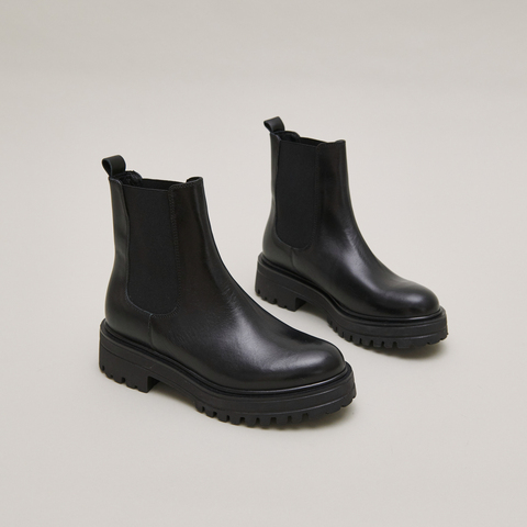Boots &agrave; semelles crant&eacute;es et &eacute;lastiques black