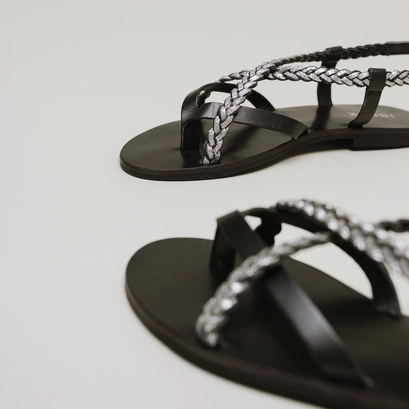 Nu-pieds &agrave; brides tress&eacute;es in black and silver leather | warren