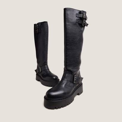 Chunky strap boots with treaded soles in black grained leather | reine