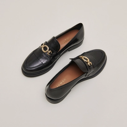 Loafers with gold buckles in black leather | delphes
