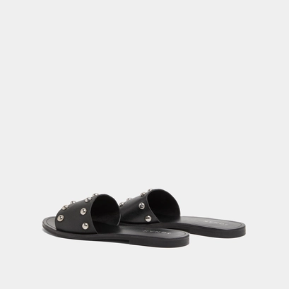 Mules &agrave; d&eacute;tails argent&eacute;s in black grained leather | winslow
