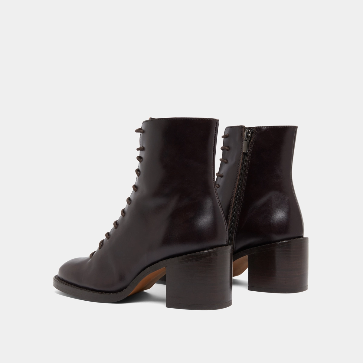 Boots &agrave; lacets et talons d&eacute;bordants in dark brown leather | BRINDILLE