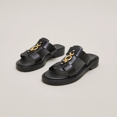 Mules &agrave; mors dor&eacute;s in black leather | dop