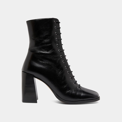 Bottines &agrave; talons lac&eacute;es in black distressed leather | vandelle