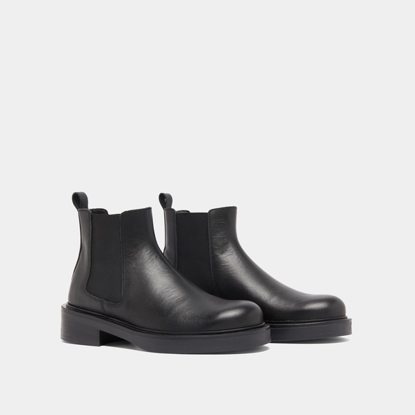 Boots &agrave; &eacute;lastiques in black leather | MELANIE